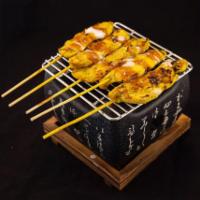 Chicken Satay · Grilled slices of marinated chicken on skewers, coconut milk served with peanut sauce and cu...