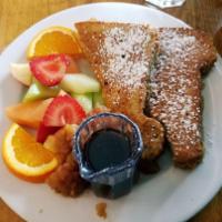 Brioche French Toast · Seasonal fruit and huckleberry or maple syrup.