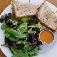 Gouda Mouda Sandwich · Roasted turkey, smoked gouda, chipotle grilled onions, lettuce, tomato, red pepper aioli on ...