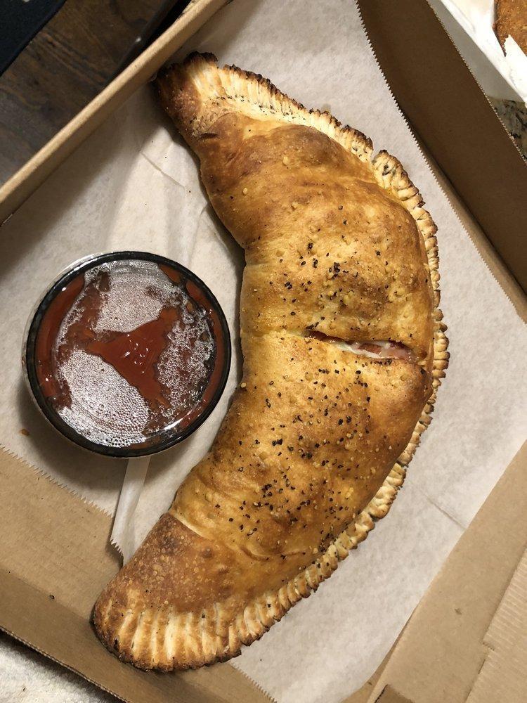 Calzone · Made with our house cheese blend and creamy ricotta, folded into our homemade pizza dough shaped like a half-moon. 