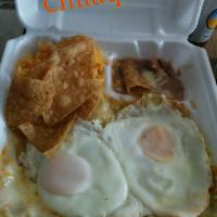 Chilaquiles · Corn tortillas mixed with red or green sauce, melted cheese and sour cream.