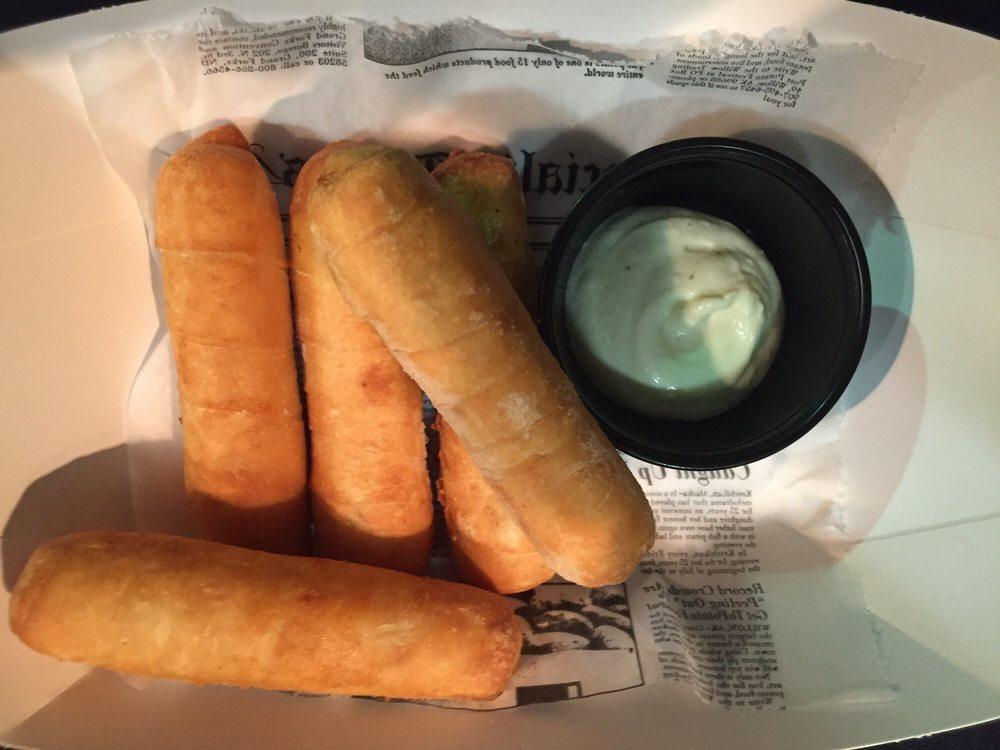 Tequenos · Fried cheese sticks.