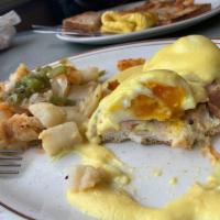 Eggs Benedict · 2 poached eggs with Canadian bacon on a muffin topped with hollandaise sauce.