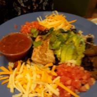 Island Bowl · A large serving of black beans and brown rice topped with shredded cheddar Jack cheese, sour...