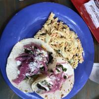 Chimichurri Pork Tacos · Our pork slow roasted and cooked in house, shredded cheddar jack cheese, fresh chimichurri s...
