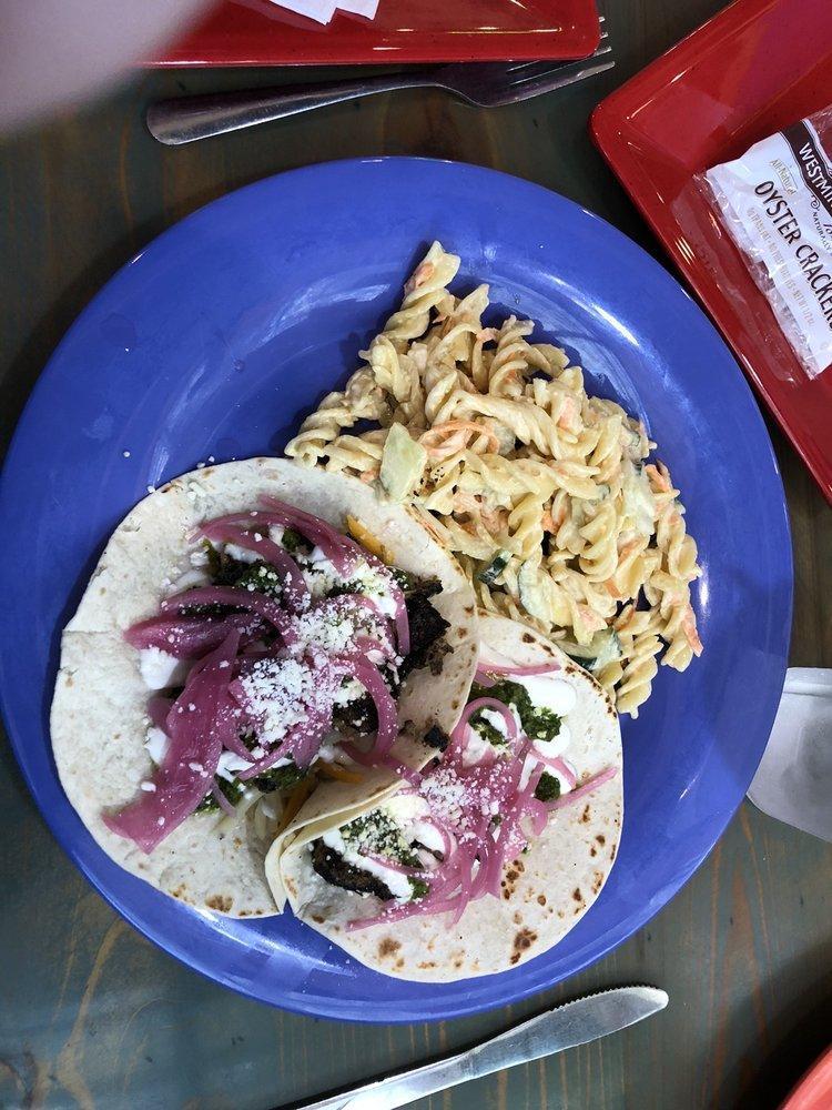 Chimichurri Pork Tacos · Our pork slow roasted and cooked in house, shredded cheddar jack cheese, fresh chimichurri sauce, pickled onions, cotija cheese and topped with our very own cream.