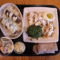 Chicken Shawarma Plate · Halal. Slices of seasoned chicken over a bed of rice, hummus. Served with salad and hummus. ...