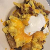Bangor Bowl · 3 scrambled eggs, sausage, bacon and cheddar cheese over tater tots topped with a dollop of ...