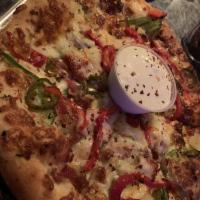 Hawaiian Pizza · Herb sauce, ham, pineapples, bacon, green and red peppers, provolone, mozzarella and jalapen...