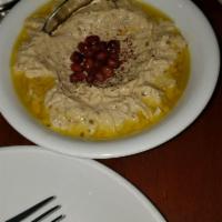 Baba Ghanoush · Pureed eggplant, tahini, garlic and lemon pomegranate (when in season). Gluten free.
