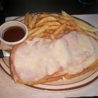 Monte Cristo Sandwich Lunch · Open face sandwich made with French toast, with sliced turkey, ham and provolone cheese. Ser...