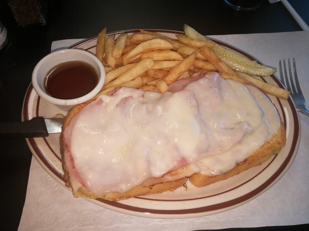 Monte Cristo Sandwich Lunch · Open face sandwich made with French toast, with sliced turkey, ham and provolone cheese. Served with french fries and pickle.