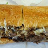 Shroomy Swiss Sandwich · Beef brisket, grilled herb sauteed mushrooms, melted Swiss, lettuce, tomato and mayo on a bu...
