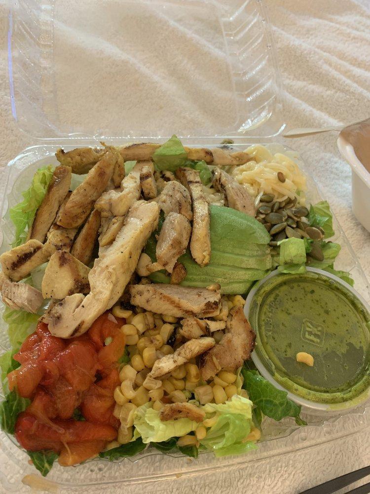 Cilantro Lime Salad · Crisp romaine lettuce, spinach leaf, fresh-grilled citrus marinated chicken, shredded pepper jack cheese, fire roasted bell peppers, roasted pumpkin seeds, spit fire corn, Hass avocado and zesty cilantro lime dressing.