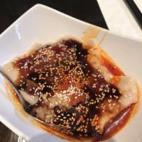 Chili Oil Wontons · Ten steamed pork wontons, Sichuan brown sauce and chili oil. 