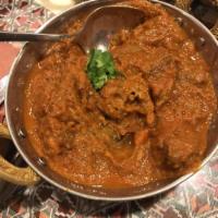 Lamb Curry · Boneless free range lamb, onion and tomato base curry with house roasted spices.