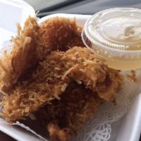 Coconut Shrimp · Shrimp dipped in a batter of shredded fresh coconut, lightly fried, and served with sweet an...