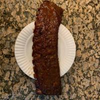 Baby Back Ribs · Hickory smoked and you can choose them dry which is with just a rub finish; or finished with...