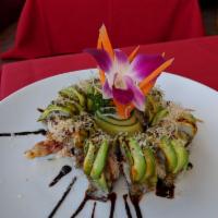 Tarantula Roll · Fried jumbo soft shell crab, cucumber, crab topped with avocado and bonito flake served with...
