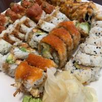 Spider Roll · Fried jumbo soft shell crab, crab, cucumber, yamagobo, lettuce and avocado topped with masag...