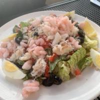 Dungeness Crab and Shrimp Louie Salad · Egg, tomatoes, olives, jack cheese, thousand island dressing. Gluten free.