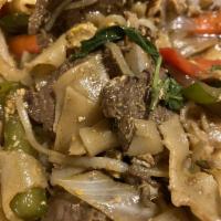 Drunken Noodles · Wide flat rice noodles, bean sprouts, bell peppers, scallions, onions, Thai basil.