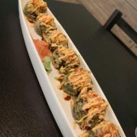 Dynamite Roll · Spicy tuna, avocado, deep fried, topped with spicy crabmeat, spicy mayo and eel sauce.