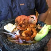 Molcajete Mixto · Spicy. Grilled steak, chicken and shrimp smothered in our special house sauce, Mexican chees...