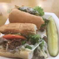 Steak Special Sandwich · Thinly sliced USDA choice Philly steak, grilled onions and fresh green peppers, melted provo...