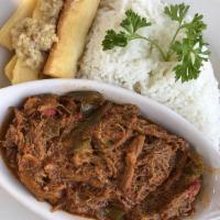 Ropa Vieja · Shredded beef slow-cooked in tomato and wine sauce.