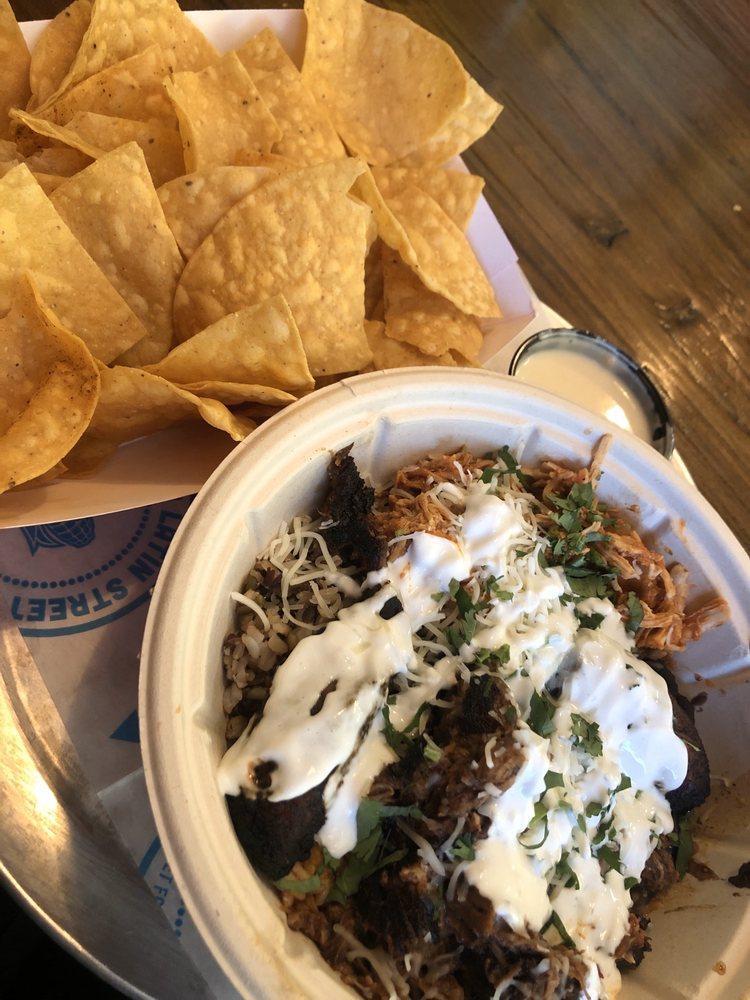 Cuban Bowl · Barbacoa, shredded chicken, black beans, plantains, 2 kinds of rice and lime wedge.