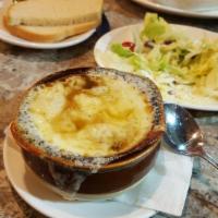 French Onion Soup · Chopped onions in a beef broth topped with bread Swiss and provolone cheese.