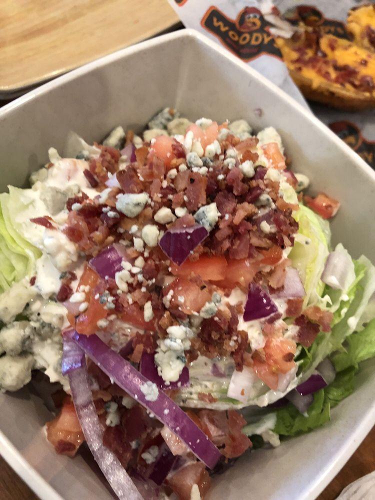 Wedge Salad · Iceberg wedge topped with tomato, red onion, crisp bacon and bleu cheese crumbles. Served with choice of dressing.
