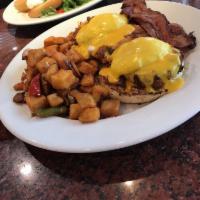 Crab Cakes Benedict · 2 poached eggs over crab cakes on a toasted English muffin,topped with hollandaise sauce, se...