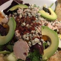 Turkey Cobb Salad · Mixed greens topped with diced turkey, Gorgonzola, diced bacon, avocado, hard boiled egg, to...