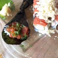 Spicy Tuna Roll · 8 pieces. Spicy marinated chopped tuna rolled in seaweed and rice. Spicy.