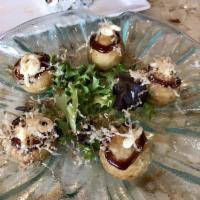 Takoyaki · Five crispy buttered chopped octopus balls topped with Japanese mayo, okonomiyaki sauce & bo...