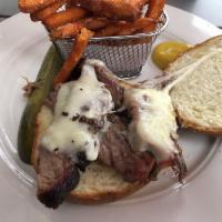 Smoked Brisket Sandwich · Our house smoked brisket topped with provolone cheese.