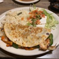 Fajita · Served on a sizzling skillet with green, yellow, red peppers, onions, and tomatoes. Served w...