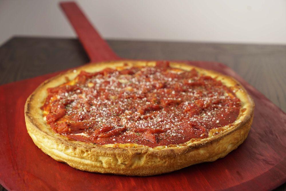 Chicago Deep Dish Pizza · Pan cooked, buttery crust that is smothered with cheese and chunky tomato sauce, then baked to perfection for over 40 minutes. Add toppings for an additional charge.