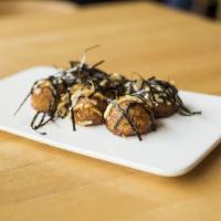 Takoyaki · Fried baked wheat ball with octopus. Served with mayo and seaweed flakes.