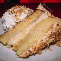 Majestic Coconut Cake · Toasted coconut-sour cream frosting. Vegetarian