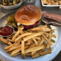 Veggie Beet Burger · Red beet and kidney bean patty, pickles, tomatoes, red onions, arugula, and lemon vinaigrette.