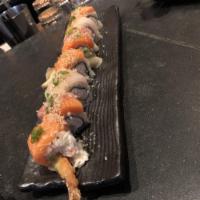 Nemo Roll · shrimp tempura, dungeness, and avocado topped with snapper and salmon, finished with ponzu, ...
