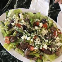 Greek Salad · Armenian salad topped with Feta cheese, Kalamata olives, and parsley. Vegetarian.