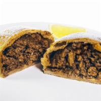 Beef Empanada · Ground beef seasoned and sautéed with onions and raisins. Served with fresh lime and Peruvia...
