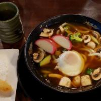 Nabeyaki Udon · Noodles with tempura shrimp, chicken and vegetables in hot soup.