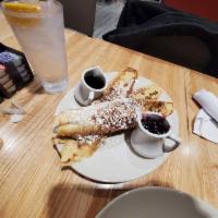 French Toast · 3 slices of French bread cooked in a house-made batter of egg, vanilla, and cinnamon stacked...
