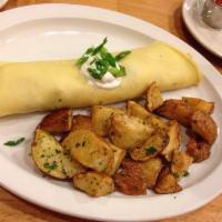Cajun Crepe · A taste of the south in a crepe with whipped eggs, andouille sausage, ham, white and green o...