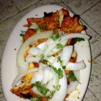 Chicken Boti Wrap · Chicken kebab rolled in a naan with salad and sauces.